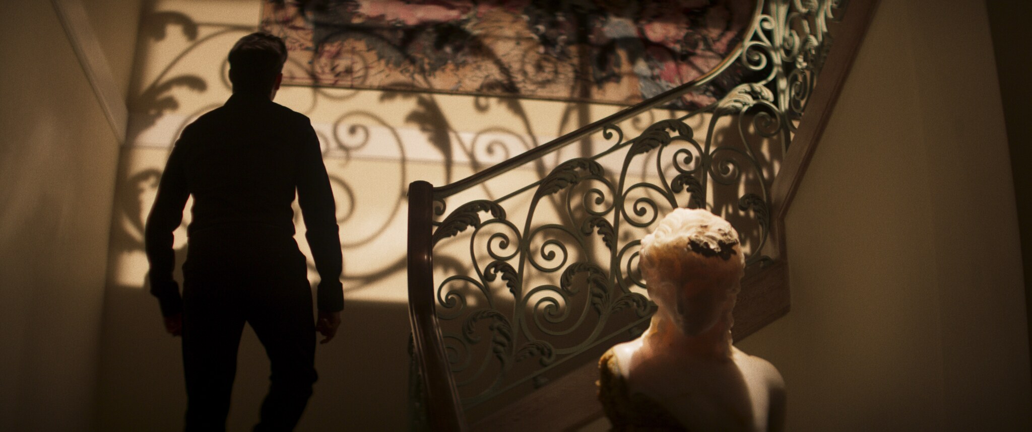 Isaac Gryn as Matt climbing an ornate staircase